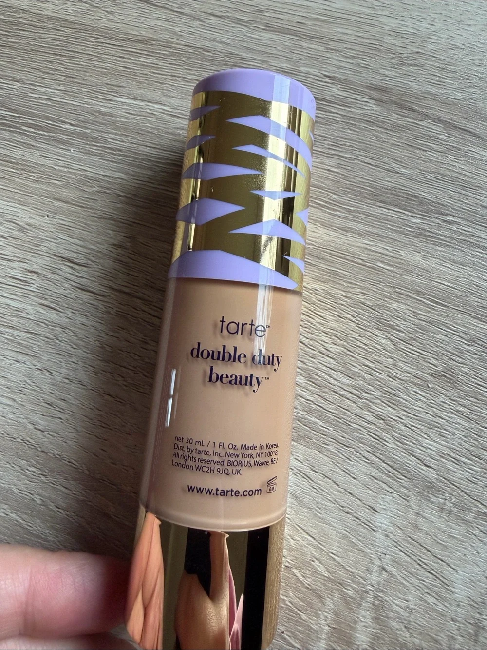 tarte Face Tape Foundation — beige with purple and gold cap accents